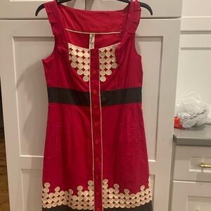 Adorable red dress with black accents and white polka dots.